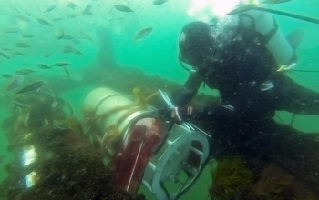 Researcher Bennett Lambert assists with FlowCytobot at the Martha's Vineyard Coastal Observatory.